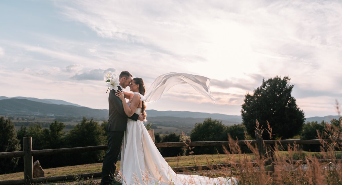 Bride getting ready in a rustic villa in Tuscany with natural window light